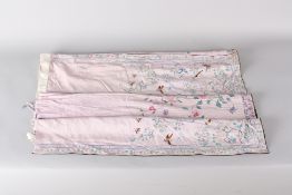 An early 20th century lady's Chinese silk skirt, comprised of two panels of silk embroidered with