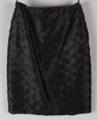 A Murray Arbeid of London early 1990s sample black silk skirt, the fabric layered in an