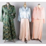 A collection of ladies night attire, comprising: 1930s nightdresses, a peach hand-knitted bed