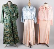 A collection of ladies night attire, comprising: 1930s nightdresses, a peach hand-knitted bed