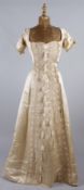 A 19th century cream satin and lace dress decorated with tassels; together with a late 19th