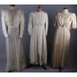 A selection of Edwardian costume, comprising: a cream satin and lace dress; a silk dress by R.E.