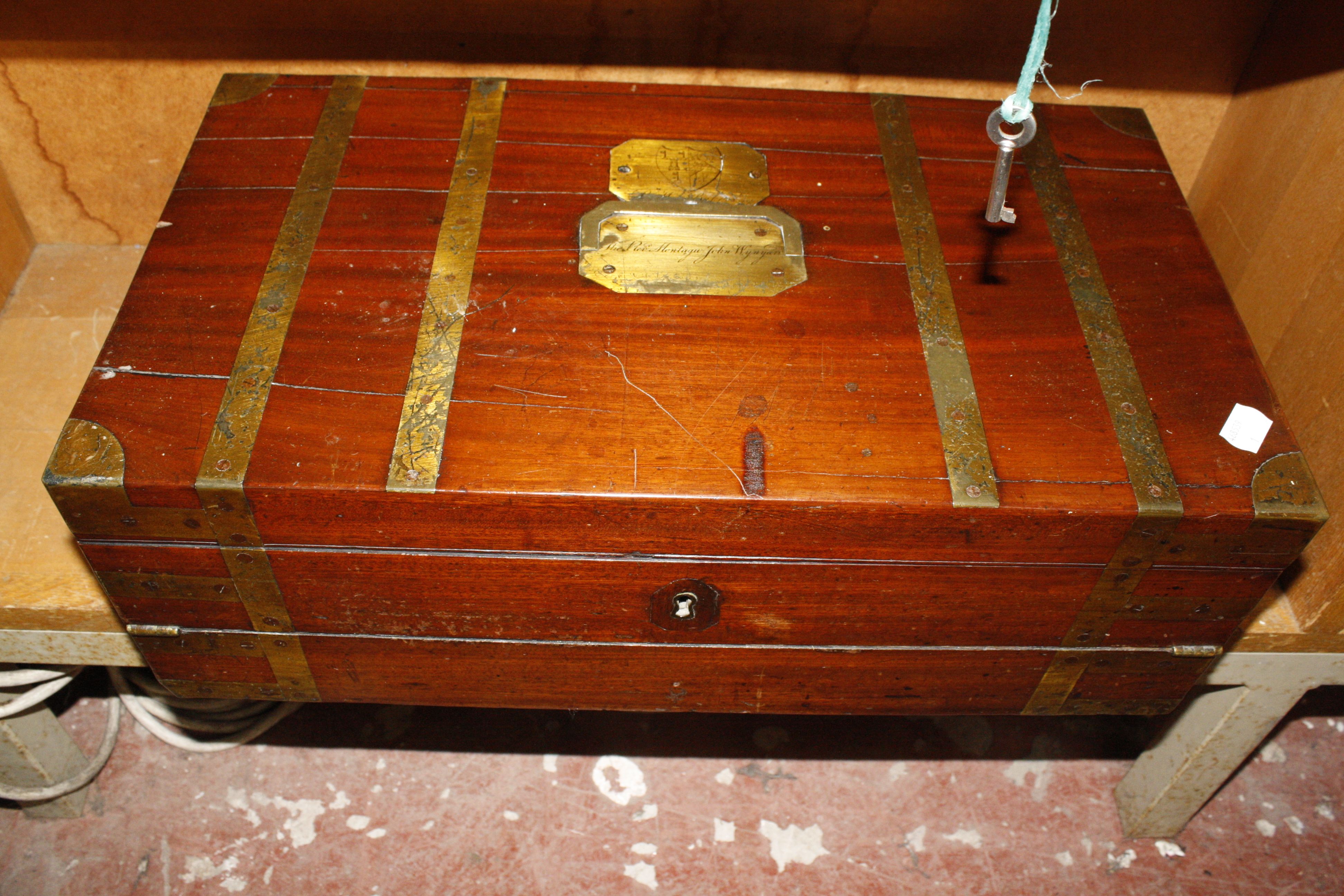 An early 19th Century mahogany brass bounded writing slope, engraved 'The Rev Montague John Wynyard'