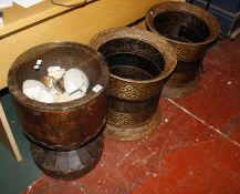 A carved hardwood vessel containing shells and a pair of wickerwork baskets