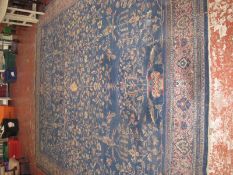 A Persian rug on blue ground 440 x 337cm
