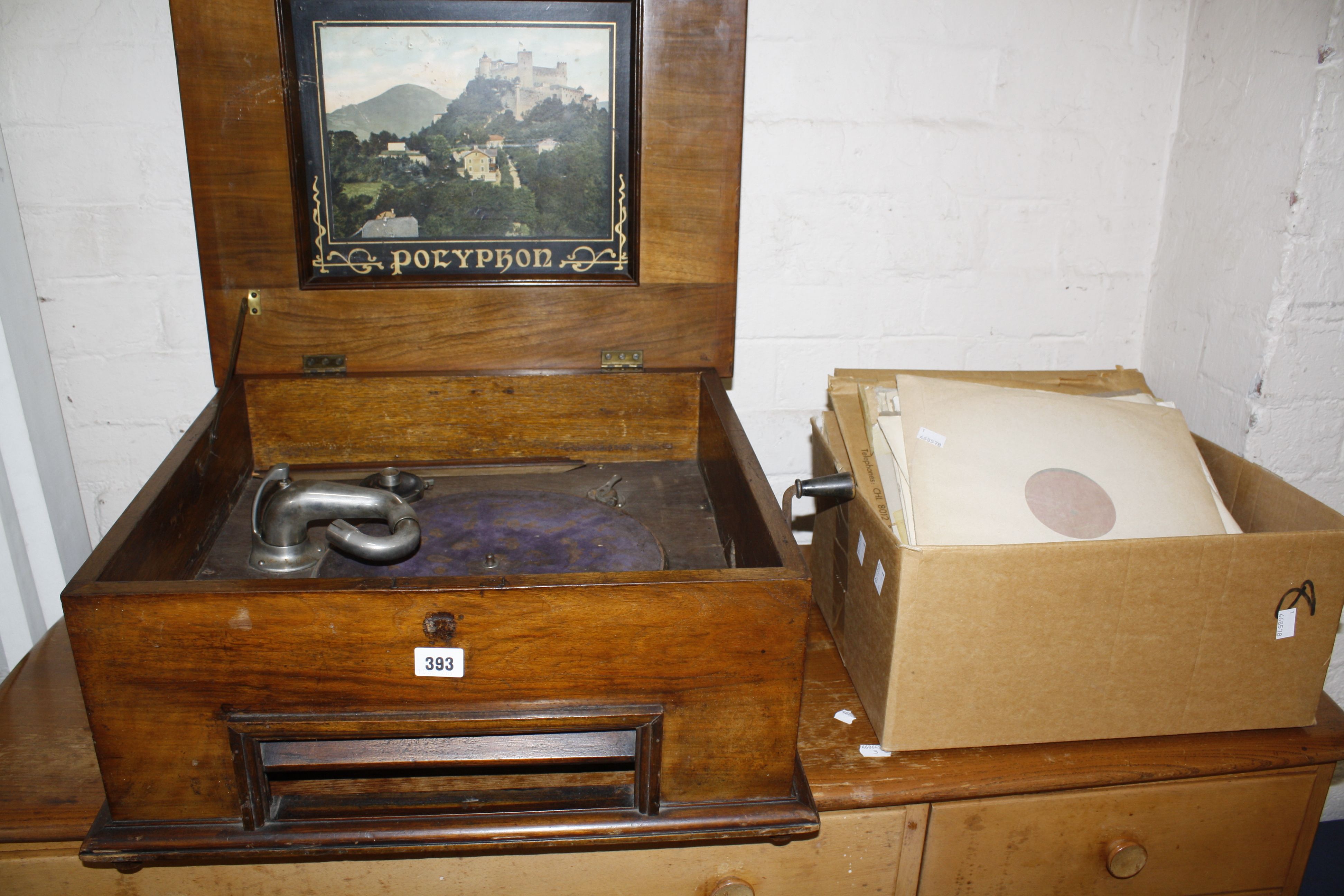 A walnut and marquetry cased polyphon and a quantity of records