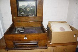 A walnut and marquetry cased polyphon and a quantity of records