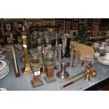 A selection of glass and metal candleholders, to include a pair of brass urns on marble stands, a