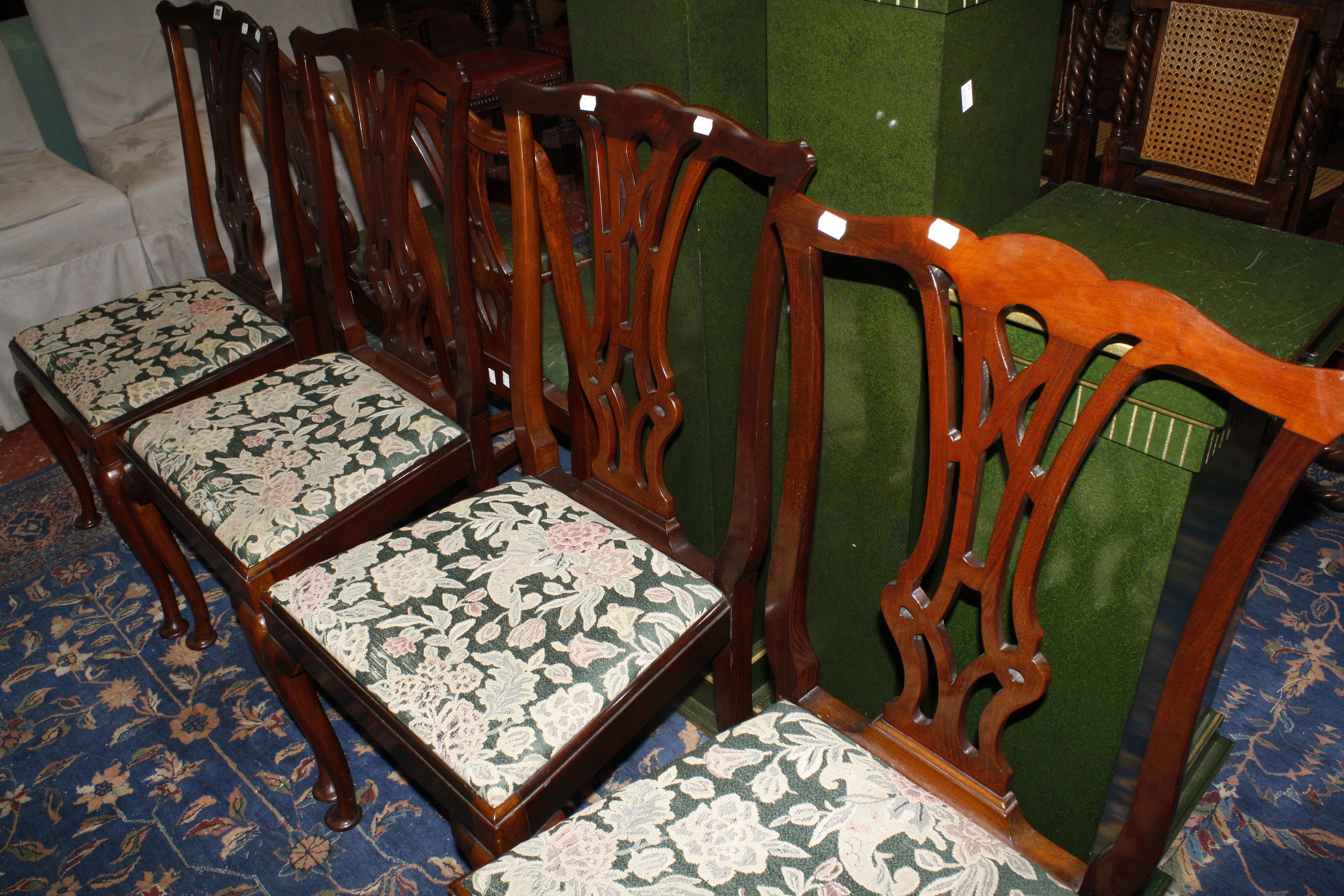 A set of four Chippendale style dining chairs with pierced splat backs, lift out seats, on - Image 2 of 2