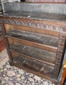 A Victorian carved oak open fronted bookcase on ogee bracket feet, 102cm