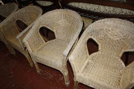 A set of four wicker armchairs   Best Bid
