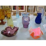 A quantity of art glass to include a Caithness dolphin patterned vase, a Bristol blue shaped vase, a