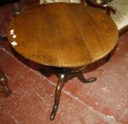 A George III oak tripod table 77cm diameter