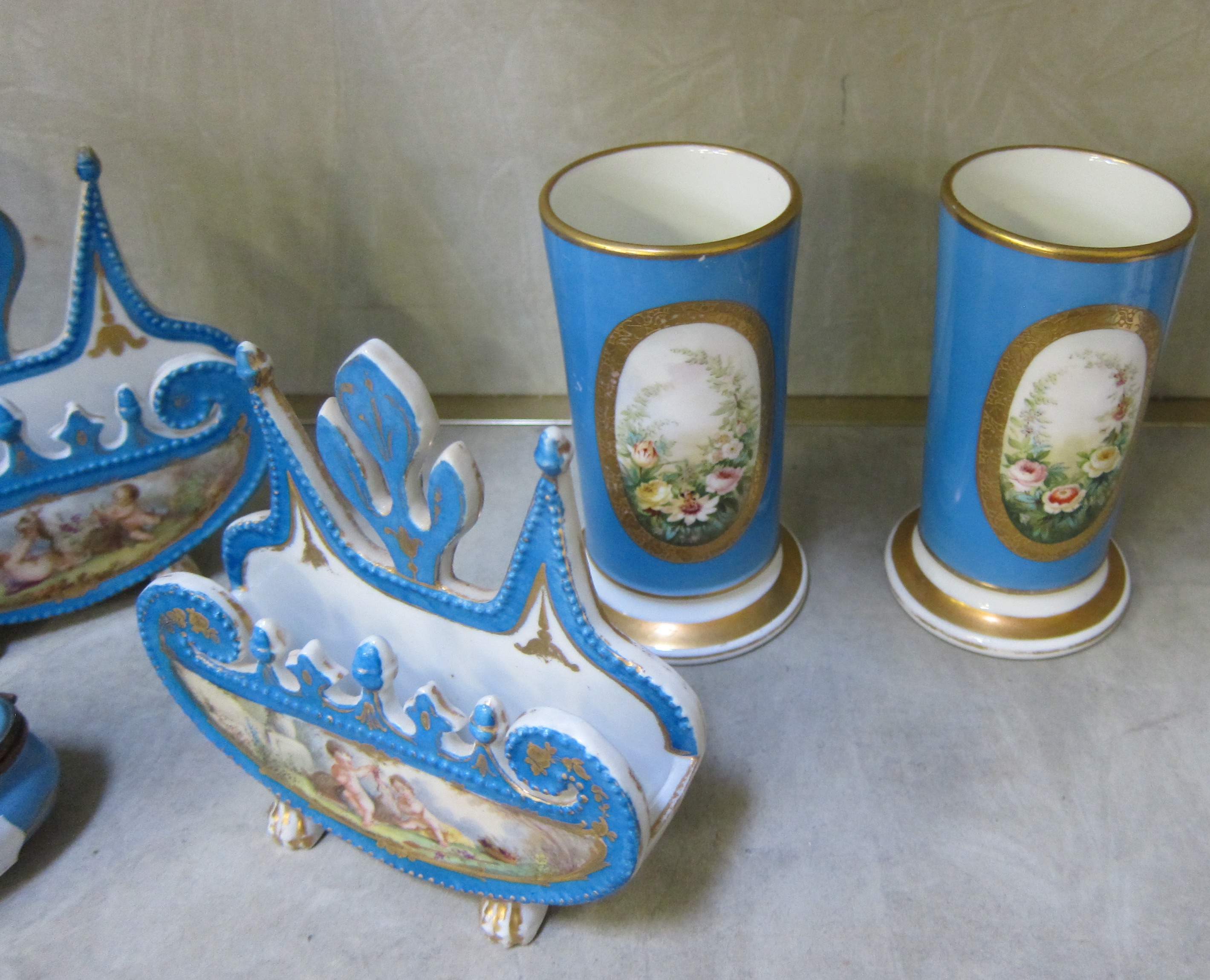 A pair of Sevres style vases painted and gilt with reserves of cherubs, on Bleu Celeste grounds, - Image 3 of 3