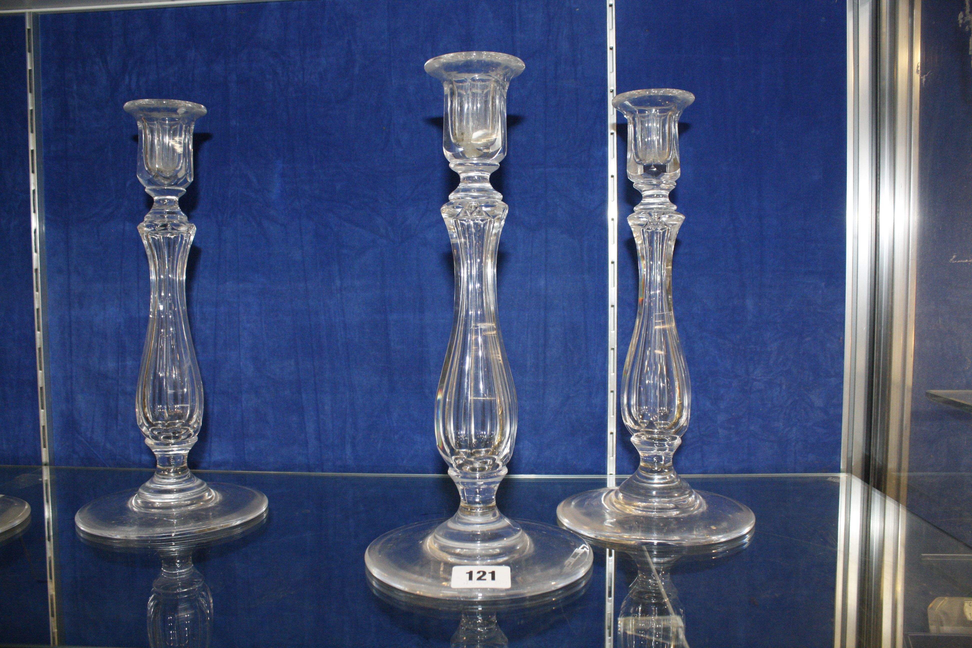 A set of four Victorian clear glass facetted candlesticks, 30cm high