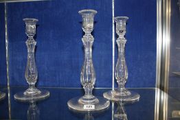 A set of four Victorian clear glass facetted candlesticks, 30cm high