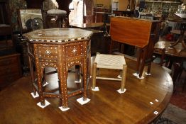 An Edwardian mahogany Sutherland table with satinwood banding to the top, an octagonal Moorish