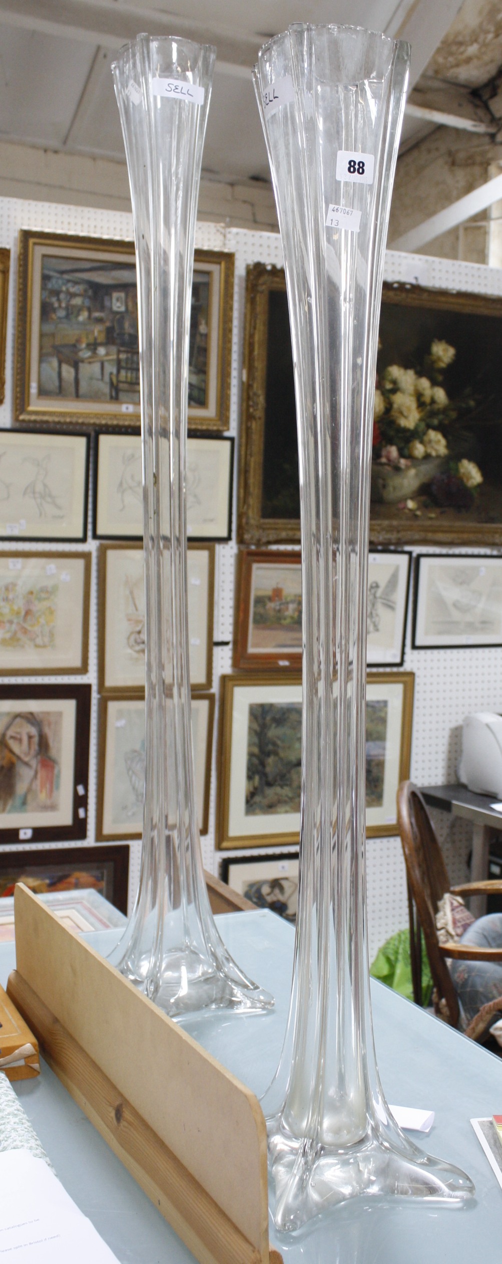Two modern large trumpet shaped clear glass vases, 108.5cm high and 91.5cm high (2)