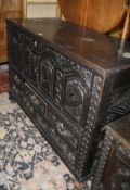 An 18th century style oak dower chest with a rising top and fitted five drawers on ogee bracket