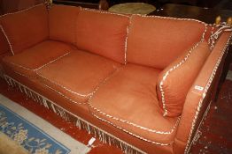 A Knole Sofa three seater in rust coloured upholstery,220cm wide.