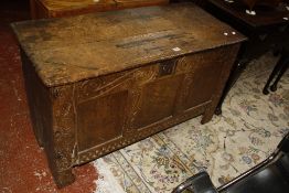A 17th Century carved oak panelled chest 111cm wide
