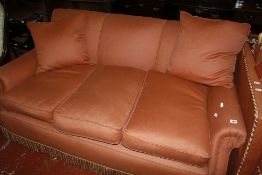 An upholstered three seat sofa, early 20th century