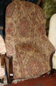An upholstered button back tub armchair, late 19th century