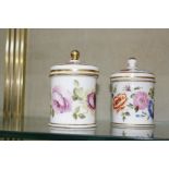 A pair of porcelain pots with covers, floral decorated, 10.5cm high (2)