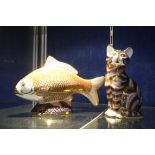 A Royal Crown Derby Imari pattern seated cat paperweight, printed mark and number LI, 13cm high