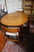 A teak dining table 134cm length and set of four dining chairs