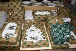 A quantity of Portmeirion 'Holly and Ivy' dinnerware and serving bowls, in original boxes.