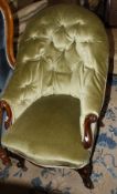 A Victorian mahogany framed button back easy chair on cabriole legs