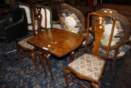 A pair of walnut dining chairs, in Queen Anne style, 20th Century and a walnut sutherland table