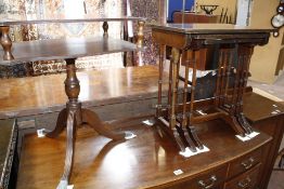 A nest of three tables and a two tier mahogany lamp table