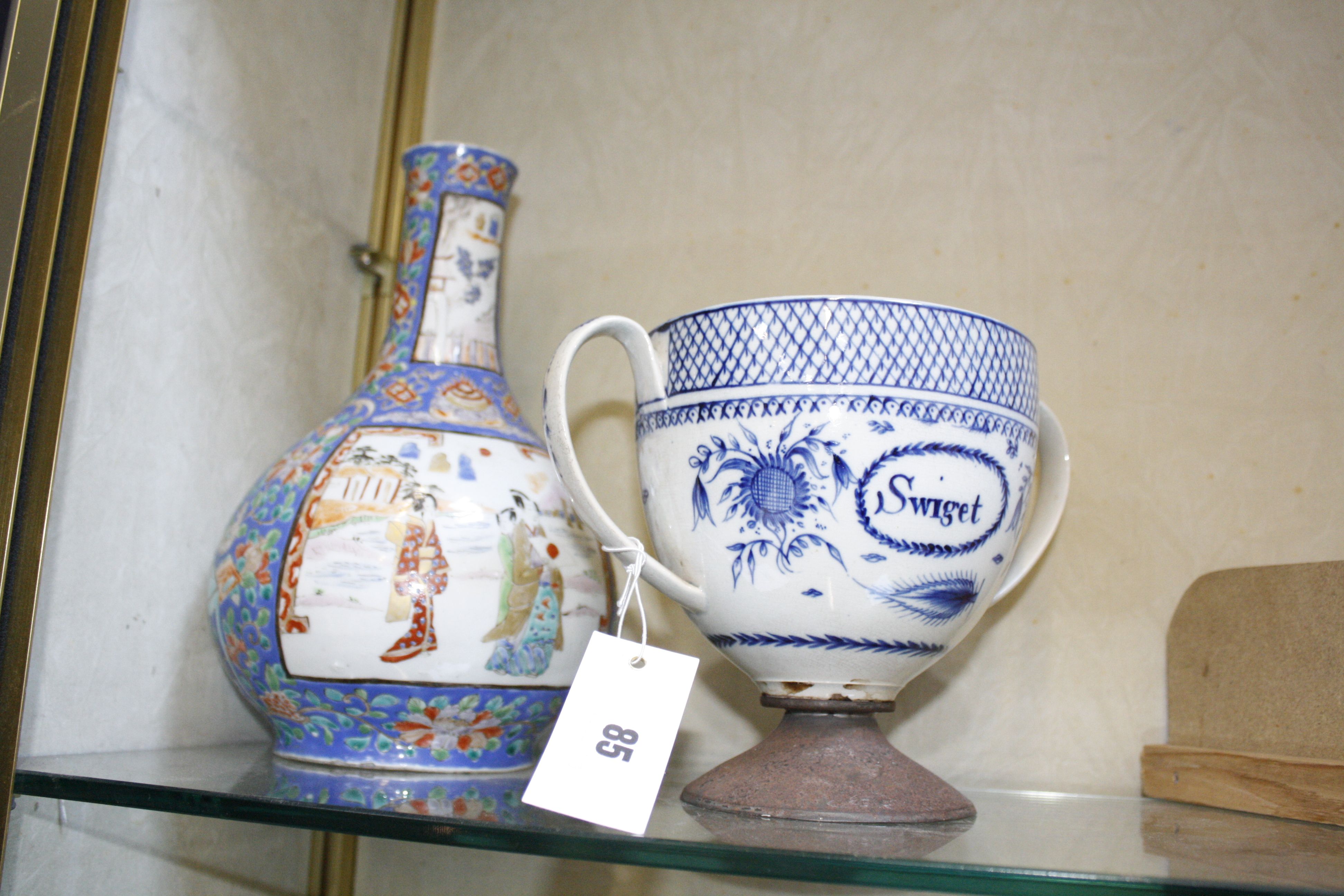 A mixed assortment of decorative ceramics to include a repaired pearlware loving cup inscribed ‘