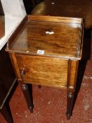 A Victorian mahogany bedside cupboard, with a gallery, cupboard on reeded legs 40cm wide