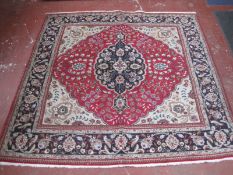 A Persian Tabriz carpet 237 x 237cm