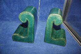 A pair of green leather Harrods retailed book-ends, scrolled shape   Best Bid