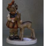 A Hummel figure of a girl and a fawn, 12.5cm high