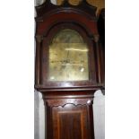A 19th Century mahogany eight day longcase clock with a brass dial and subsidiary dial 'Henry James'