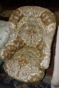 A Victorian upholstered armchair