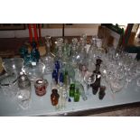 A quantity of glassware to include drinking glasses and decanters, Mdina glass vases, a part liqueur