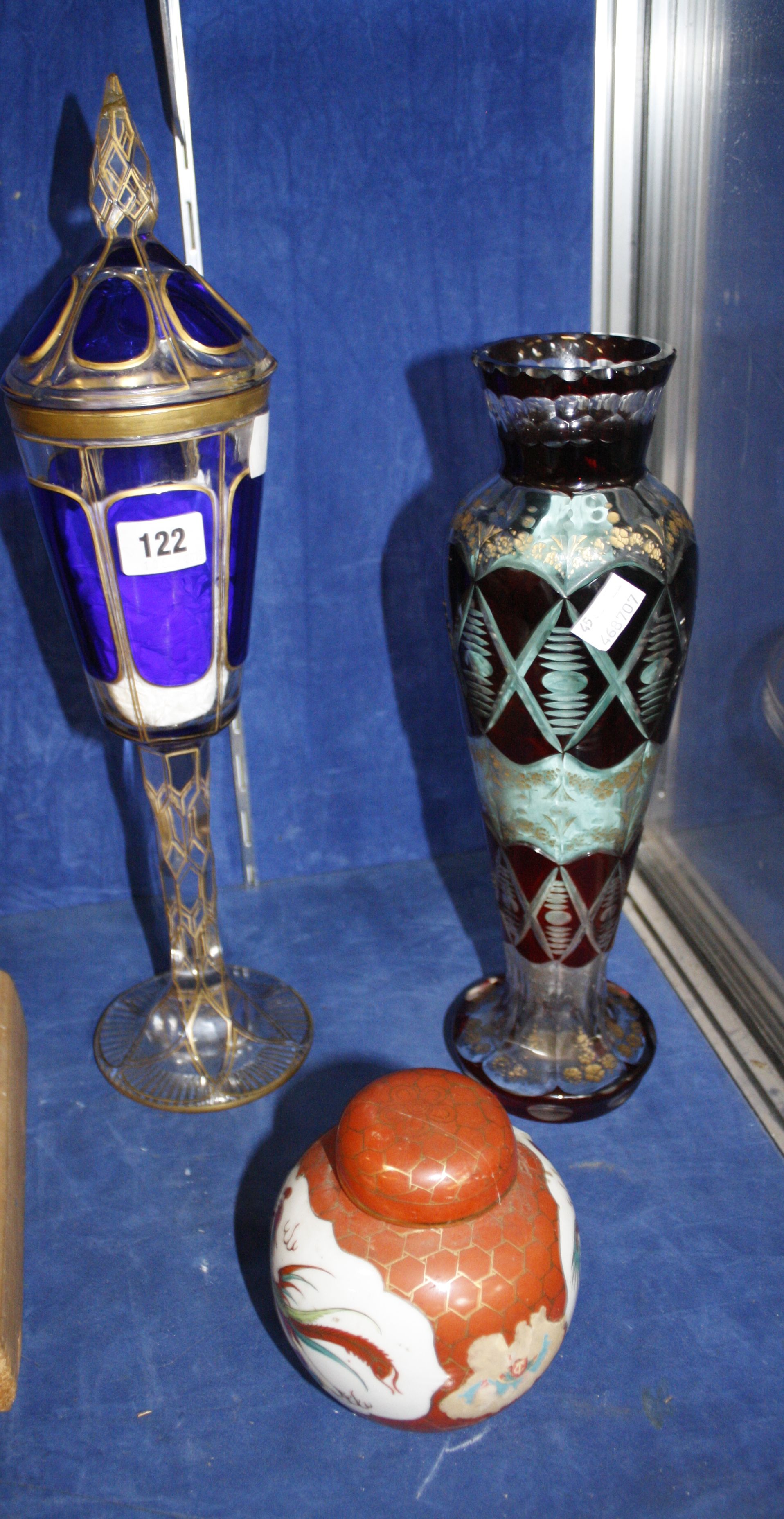 A French painted glass vase and cover in Persian style, 19th Century together with glass baluster