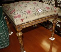 A Louis XVI style stool with needlework seat