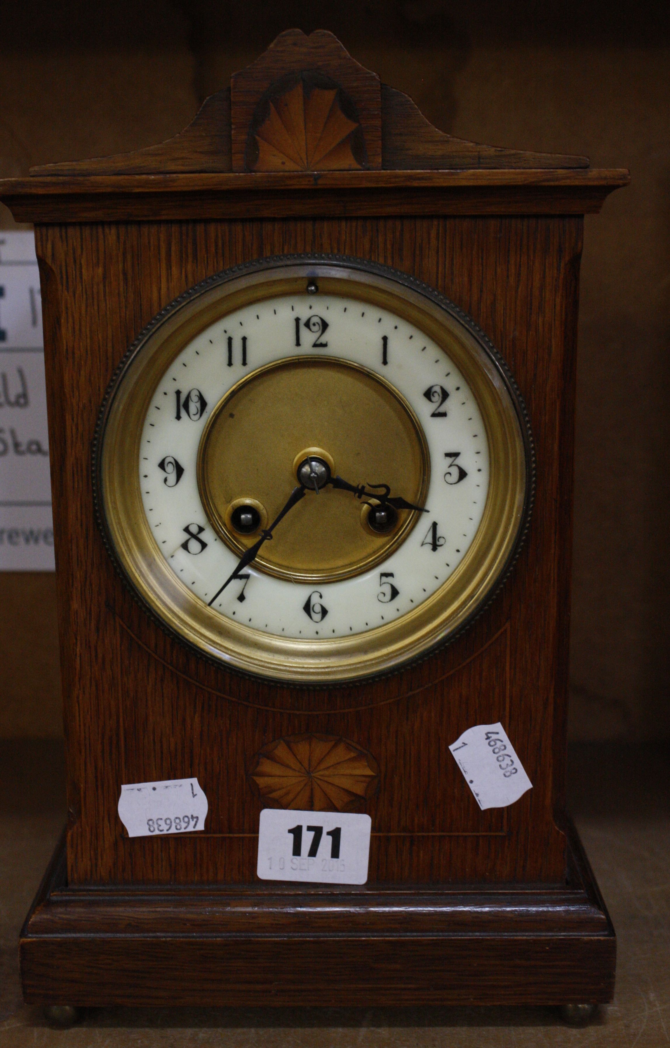 A 19th century French oak cased mantel clock