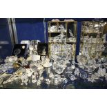 A quantity of Swarovski glass models and three display cabinets, (qty)