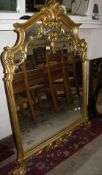 A 19th century style overmantel mirror in a decorative gilt frame, 116cm wide