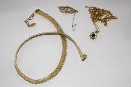 A 15ct gold and seed pearl brooch, foliate shaped, a gold coloured chain a gold coloured chain