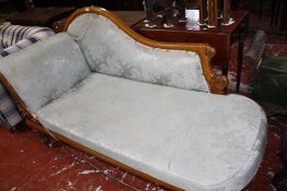 A Victorian chaise longue with swept back in damask upholstery, 170cm long.