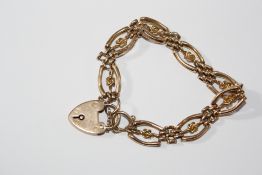 A 9ct gold link bracelet with 9ct gold heart shaped padlock clasp, 15g approx.